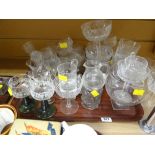 A tray of various drinking glasses and bowls