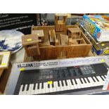 A homemade child's wooden toy fort together with a boxed Yamaha electronic keyboard