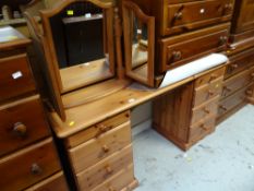 A pine dressing table and a folding mirror