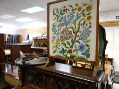 A tapestry fire screen and a Benares brass tea table with folding base