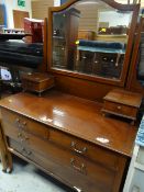 An antique mahogany mirror back dressing table