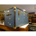 A modern brass effect and studded steamer trunk