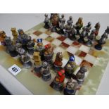 Medieval-style chess set on an onyx board