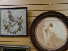 A vintage circular mahogany framed sepia print together with a vintage framed embroidery of a bird