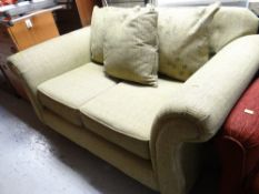 A good modern green covered two seater settee (as new)
