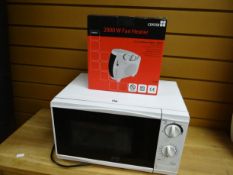 A microwave oven and boxed as new electric fan heater