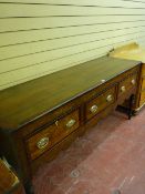 AN EARLY 19th CENTURY OAK & MAHOGANY CROSSBANDED SHROPSHIRE DRESSER BASE, the oak boarded top with