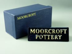 A MOORCROFT 'QUEEN'S CHOICE' TRIANGULAR POTTERY ADVERTISING SIGN, the reverse side with 'Moorcroft
