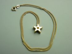 A NINE CARAT GOLD NECK CHAIN with diamond set eighteen carat gold star pendant, 4.6 grms total