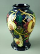 A MOORCROFT 'QUEEN'S CHOICE' BALUSTER VASE, designed by Emma Bossons, decorated on a cobalt