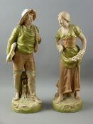 A PAIR OF ROYAL DUX STANDING FIGURES, one of a young fisherman, the other a harvest gathering