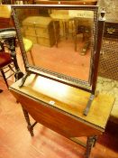 AN EDWARDIAN MAHOGANY TWIN FLAP SIDE TABLE and a vintage oak swing dressing mirror