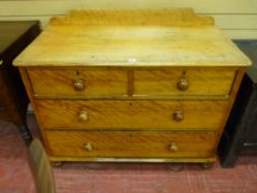 A VICTORIAN SATIN WALNUT RAILBACK CHEST of two short over two long drawers having turned wooden