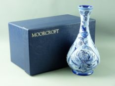A MOORCROFT 'BLUE CHRYSANTHEMUM' BOTTLE VASE, 23 cms high, in the style of MacIntyre Florian ware,