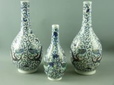 A GOOD PAIR OF 19th CENTURY CHINESE BOTTLE VASES and one other, all in Doucai decorated enamels
