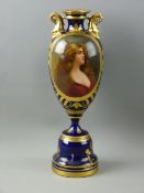 A VIENNA PORCELAIN CABINET VASE having a circular shaped deep blue ground base with gilt lining