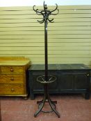 A VINTAGE POLISHED BENTWOOD COAT & HAT STAND with brolly keep, having original applied Fischel