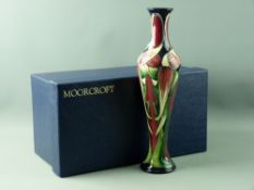 A MOORCROFT 'TRINITY' SLENDER VASE, 31.5 cms high, designed by Phillip Gibson, tonal greens and