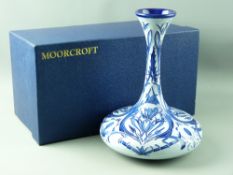 A MOORCROFT FLORIAN WARE STYLE SQUAT VASE, cobalt cornflower style pattern, decorated on a sky