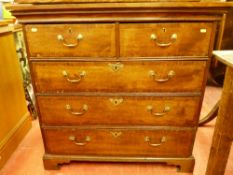 AN EARLY 19th CENTURY RUSTIC OAK CHEST of two short over three long drawers, rectangular top over