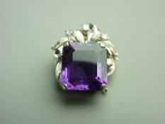 AN AMETHYST PENDANT having a strong purple emerald cut faceted stone, approximately 14.8 x 13 mm and