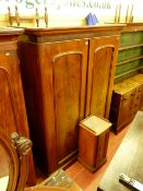 A VICTORIAN MAHOGANY TWO DOOR WARDROBE with a near matching pot cupboard, the wardrobe with inverted