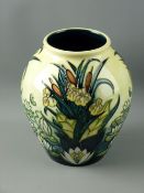 A MOORCROFT 'LAMIA' BULBOUS VASE, 21 cms high, decorated on a yellow ground, impressed factory marks