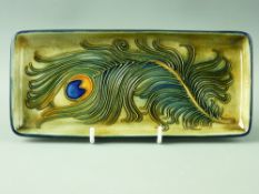 A MOORCROFT 'PEACOCK FEATHER' PIN TRAY, trial piece, decorated on a sandy background with cobalt