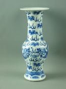 A 19th CENTURY BLUE & WHITE VASE having a long trumpet flared neck over a baluster shaped body,