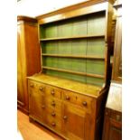 A 19th CENTURY ANGLESEY OAK DRESSER, the three shelf shape sided rack with wide green painted