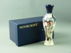 A MOORCROFT 'WILD CYCLAMEN' 2004 TRIAL PATTERN VASE, 20.5 cms high, decorated on a cream and