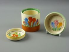 THREE CLARICE CLIFF POTTERY ITEMS including an early 7.75 cms diameter pin dish with interior floral