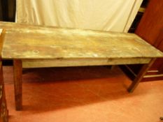 A VINTAGE RECTANGULAR PINE FARMHOUSE TABLE having a three plank top and bolt-on corner square