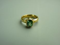 AN EIGHTEEN CARAT GOLD TOURMALINE DRESS RING having an oval faceted solitaire, approximately 9.7 x 7