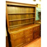 AN ANTIQUE OAK DENBIGHSHIRE STRAIGHT FRONT WELSH DRESSER, the wide boarded three shelf rack with