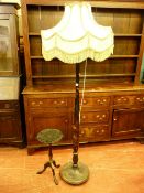 A BLACK LACQUER CHINOISERIE DECORATED STANDARD LAMP with tasselled velum shade and an ebonized