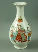 A 19th CENTURY CHINESE PORCELAIN VASE of waisted form with trumpet flared neck, decorated in red,