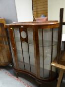 Vintage mahogany veneered concave door display cabinet