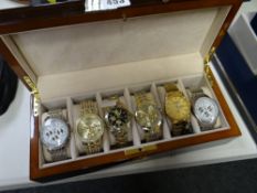 A wooden boxed collection of six various make gents large faced wrist watches