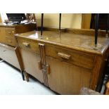 A vintage oak two door two-drawer sideboard together with a Beautility vintage sideboard with drinks