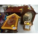 A vintage dome topped mantel clock, small copper carriage clock & cuckoo clock