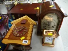 A vintage dome topped mantel clock, small copper carriage clock & cuckoo clock