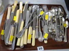 A tray of various flatware