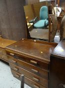 A vintage four-drawer and mirrored dressing table together with a vintage chest of drawers