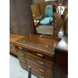 A vintage four-drawer and mirrored dressing table together with a vintage chest of drawers