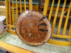 A rustic tree trunk-section wall clock