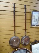 Two vintage copper bed warming pans