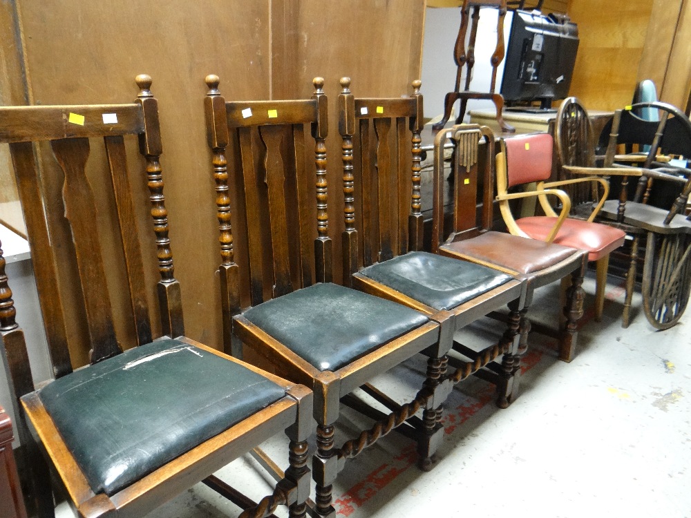 A parcel of chairs to include two dark oak wheel back & spindled chairs plus five others in