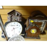 A parcel of five clocks including a cuckoo clock, retro day & date wall clock, oak domed mantel