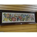 A carved mahogany framed tapestry / embroidery of flowers dated 1946